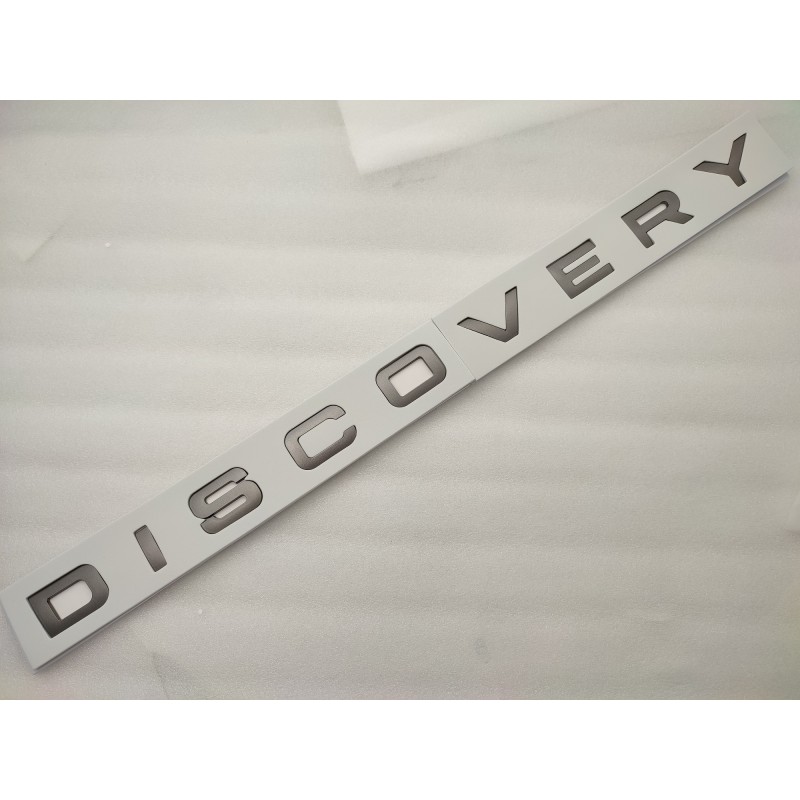 Emblema delantero o trasero letras discovery grises